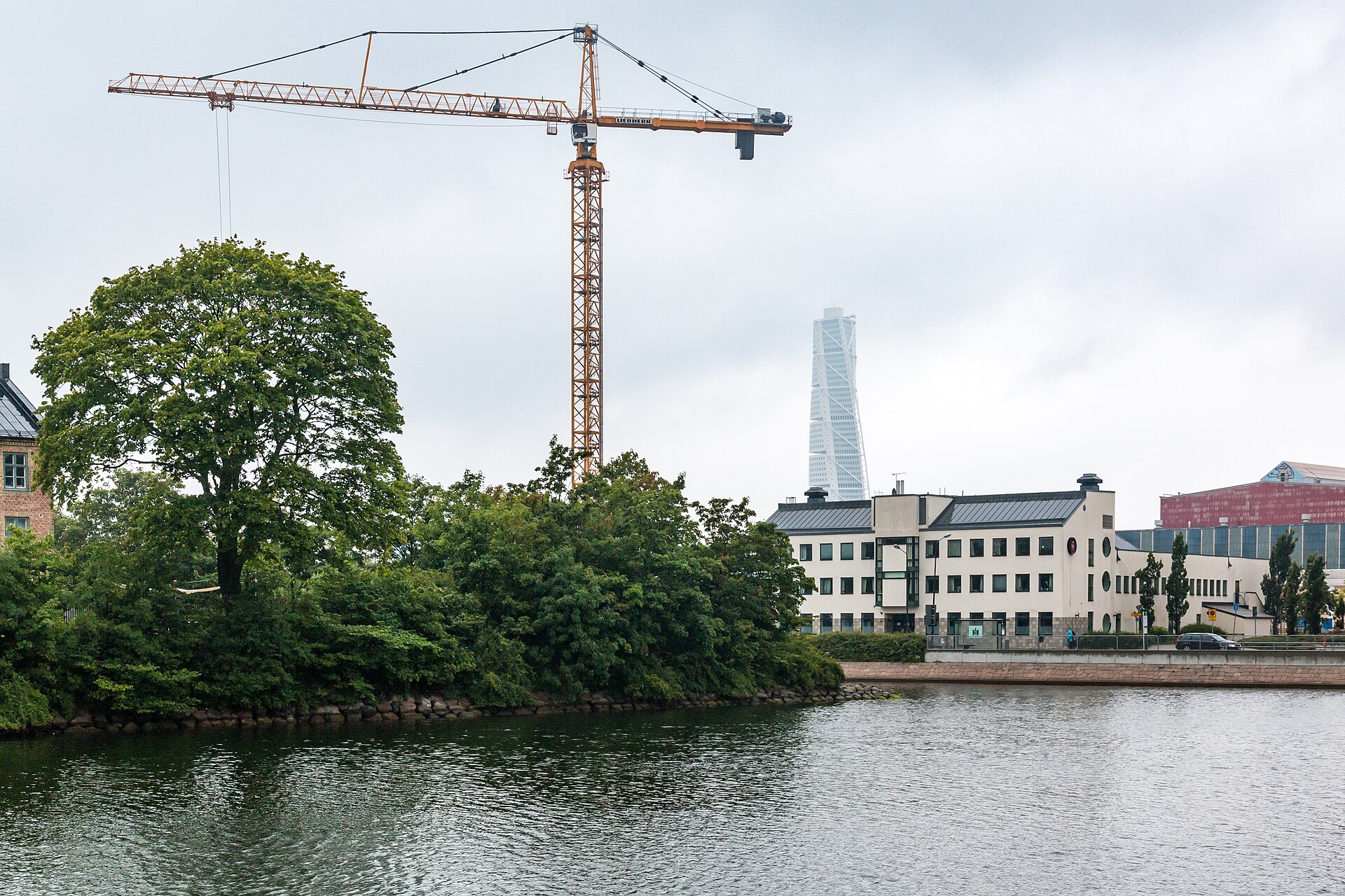 A cityscape with a construction crane, representing growth and building an online presence for digital creators.